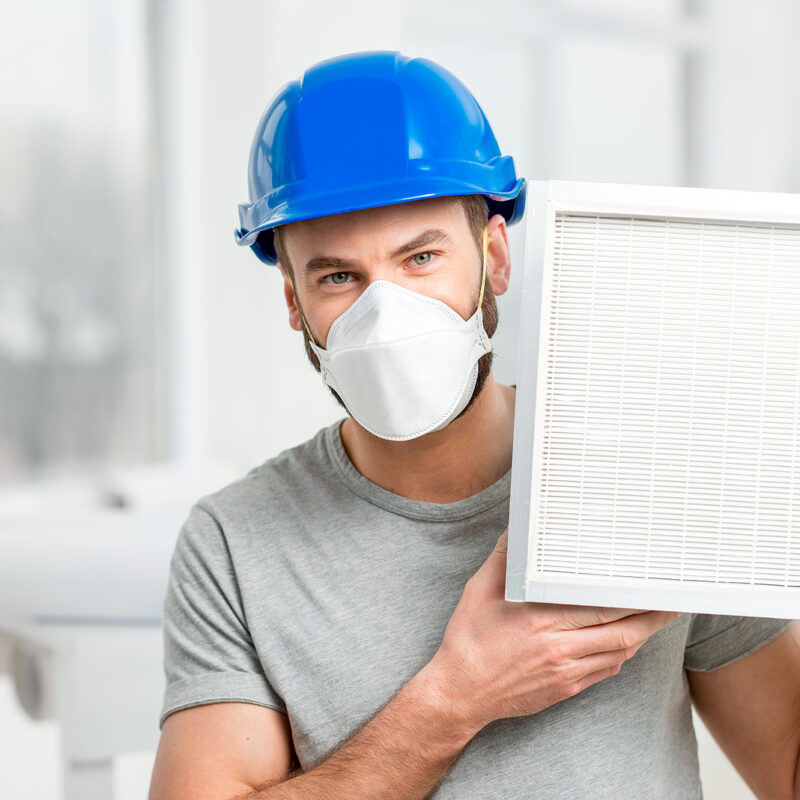 HVAC-Technician-Holding-Air-Filter-for-Home-Air-Conditioner-System