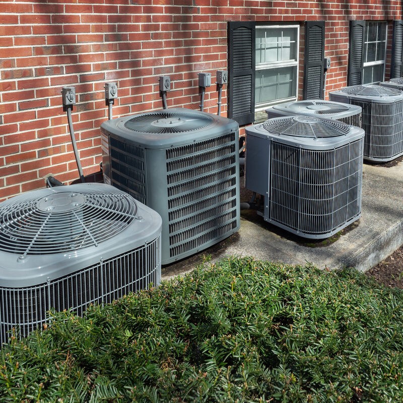 High-Efficiency-Modern-AC-Heater-Units-Outside-an-Apartment-Complex